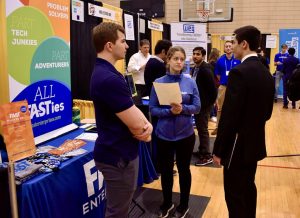 Gina Akselrod of FAST Enterprises talks with a student