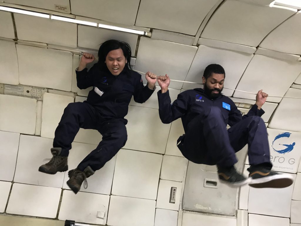 Grad students floating weightless in Zero G
