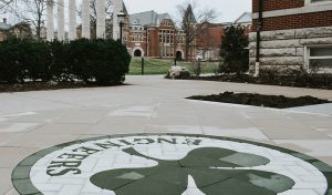 A shamrock mural with the word "Engineers" decorates the sidewalk outside of the Mizzou Engineering building.