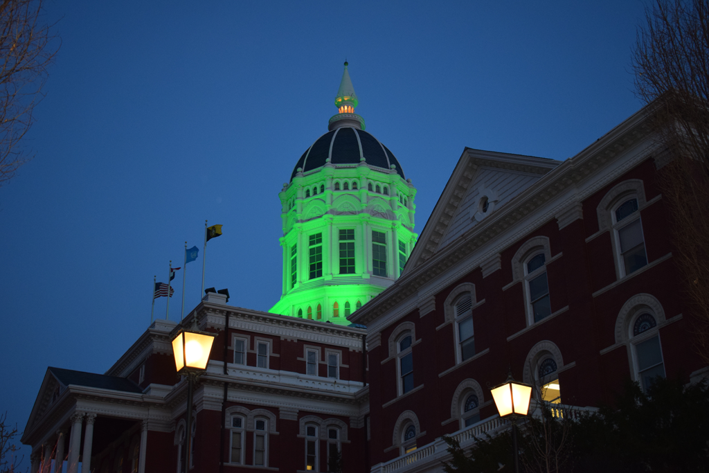 Dome of Jesse Hall lit green for E-Week