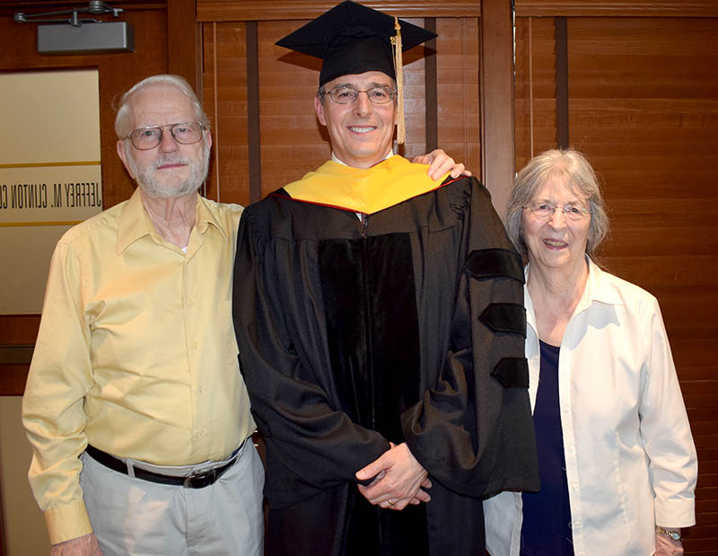 Rogers with his parents.