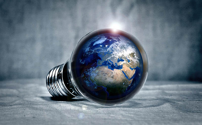 earth inside light bulb photo rendering.