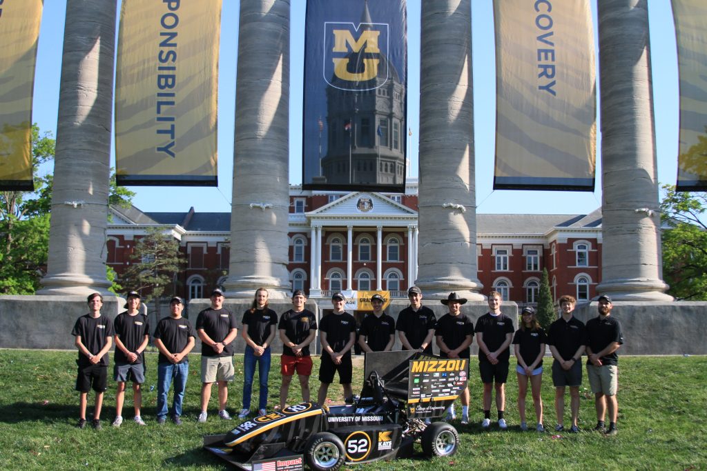 Formula SAE team with one car in front of Jesse Hall and the Columns