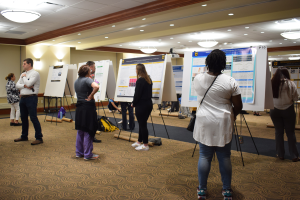 Students looking at posters at the Undergraduate Research Forum