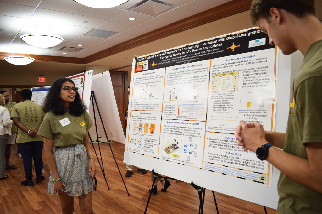 Anvitha Ramachandran and Michael Miller presenting their research poster