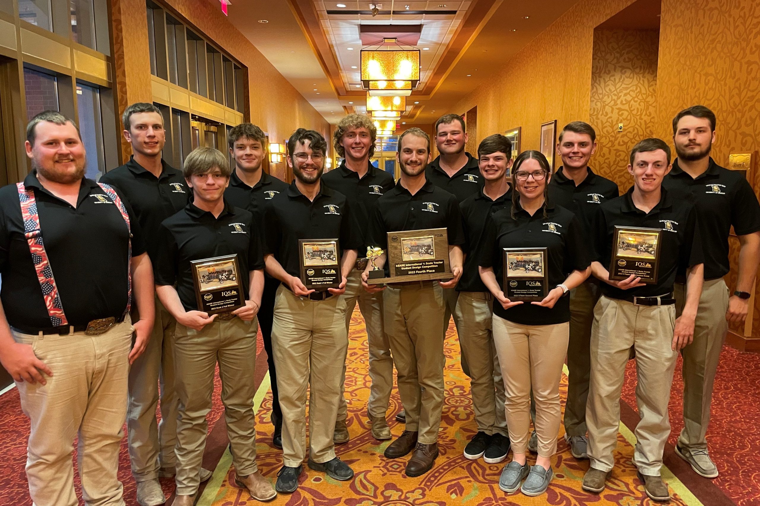 Members of the Torq'N Tigers pose with their awards after the competition banquet.