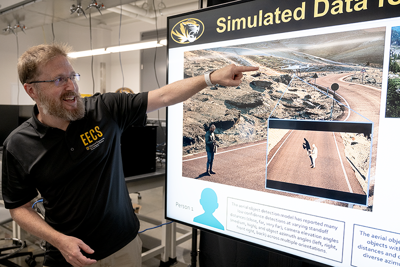 Derek Anderson points to a simulated image