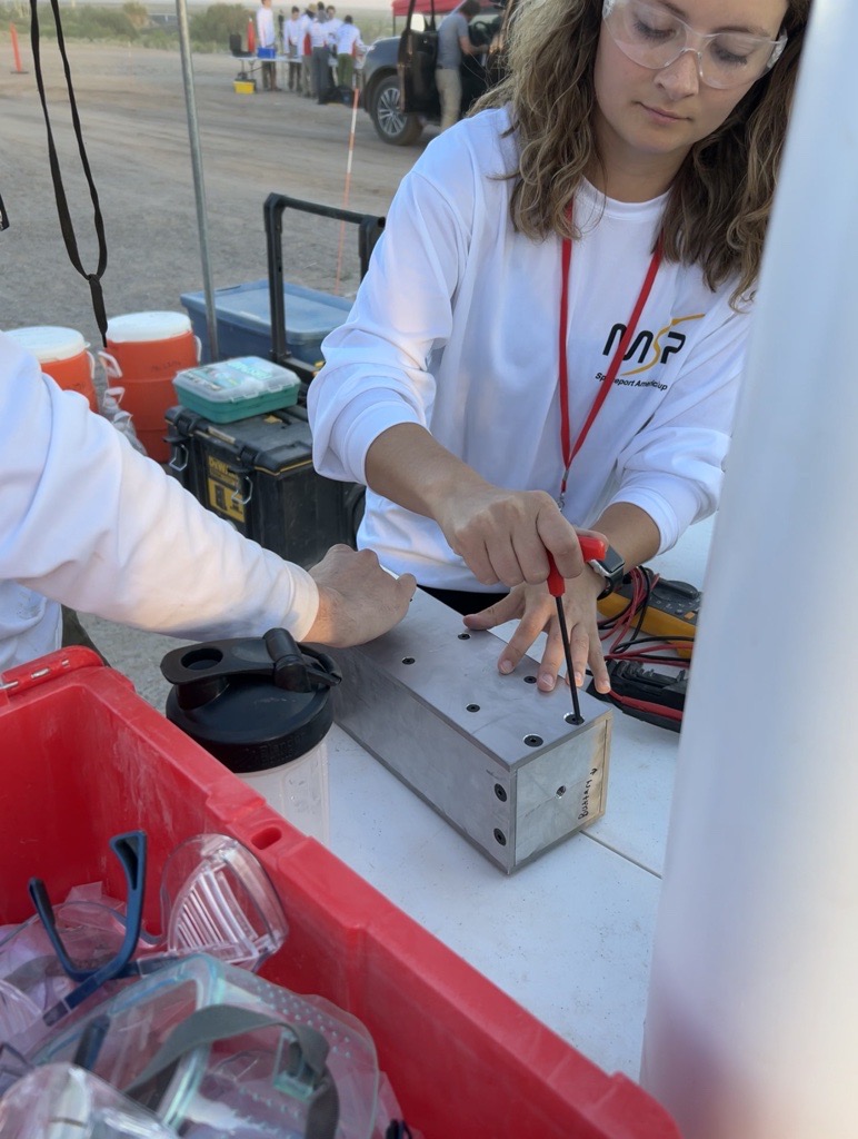 Student working on rocket at Mizzou Space Program competition