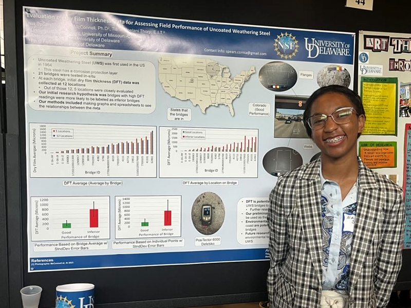 Nia Spears in front of her research poster