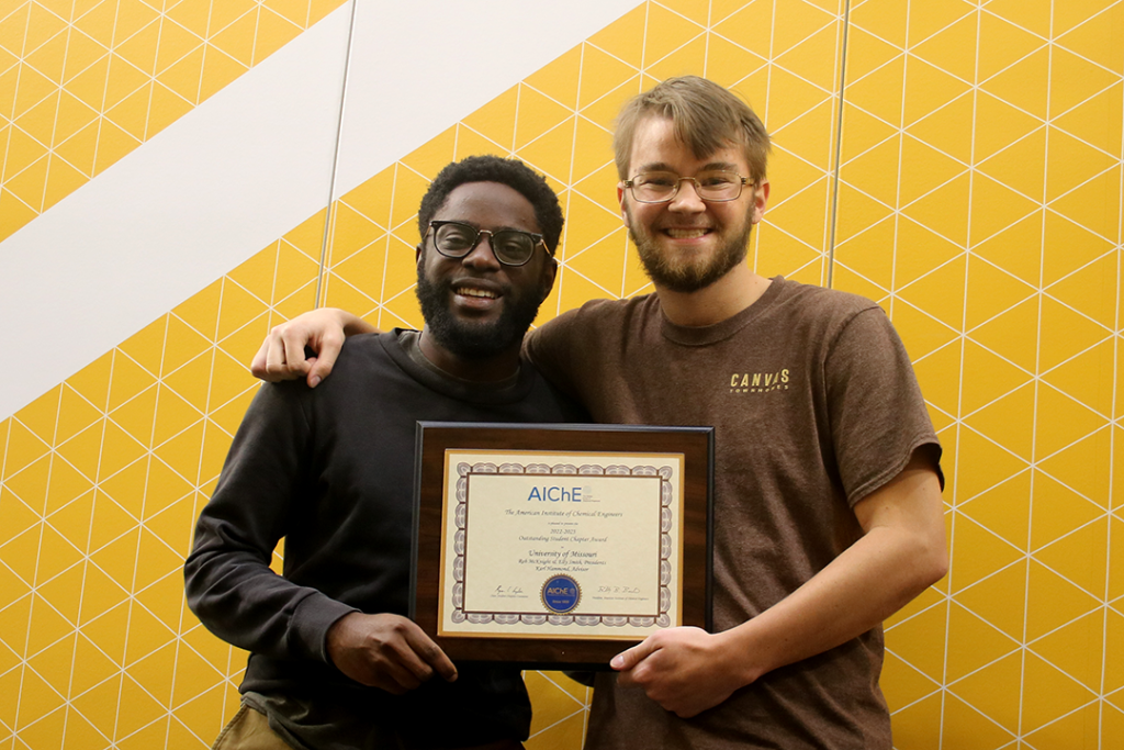 Anjola Ojo and Rob McKnight with AIChE Award