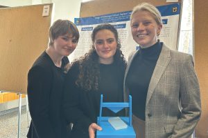 From left, Sidney Moss, Isabella Parks and Rachel Solverud with prototype