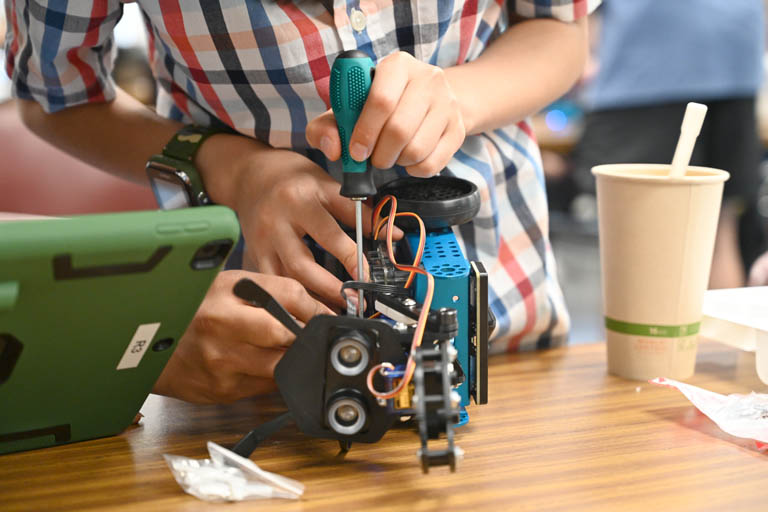 student at programmable robotics camp