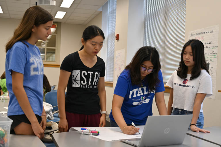 Girls experiencing environmental engineering camp activity