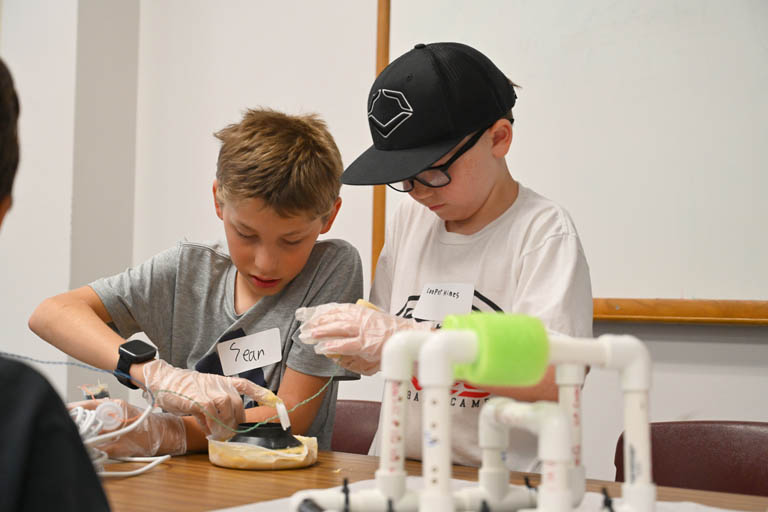 students at underwater robotics camp