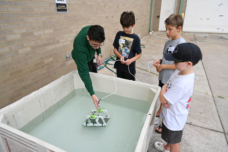 students at underwater robotics camp