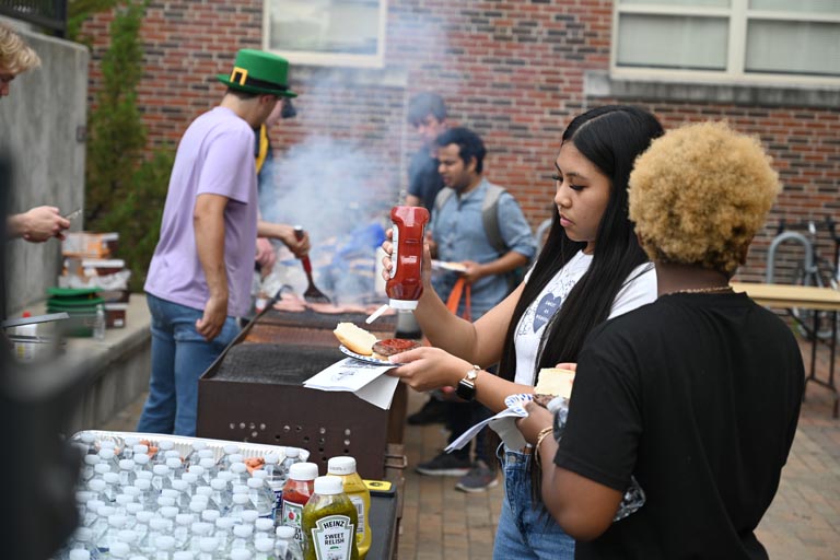 Students getting food at BBQ