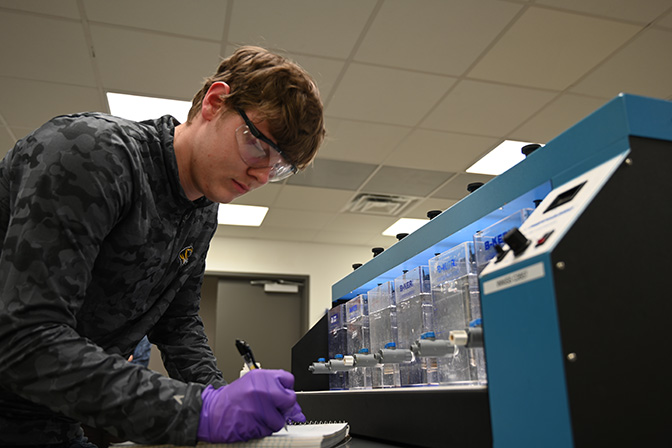 Lab student checking water quality