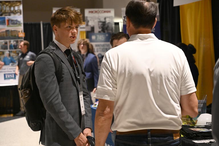 Student speaking to employer at fall 2024 career fair