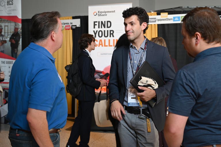 Student speaking to employer at fall 2024 career fair