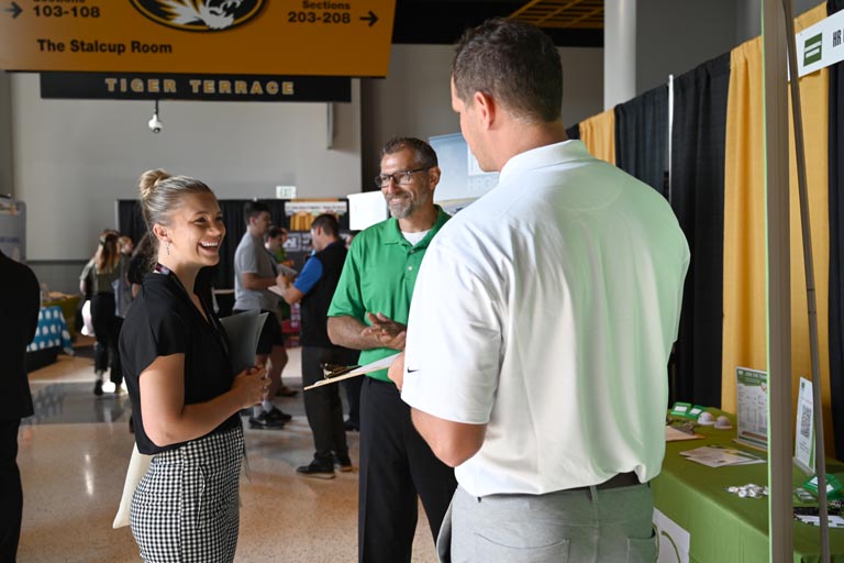 Student speaking to employer at fall 2024 career fair