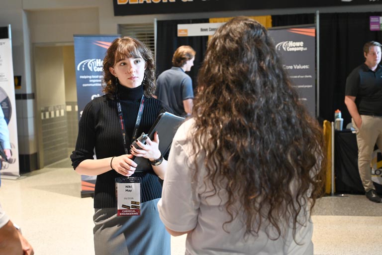 Student speaking to employer at fall 2024 career fair