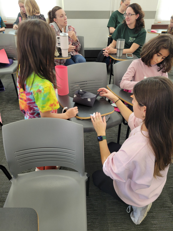 students doing projects at Girl Scout Day 2024