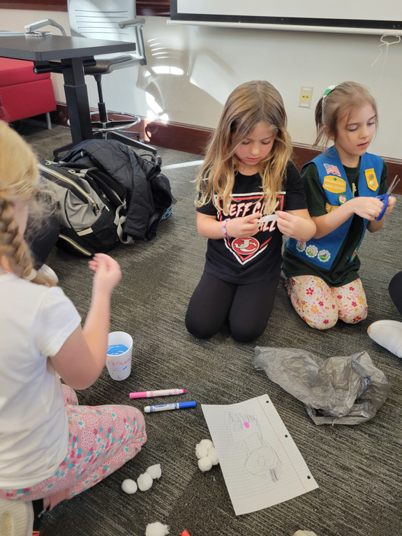 girls working on project at Girl Scout Day 2024