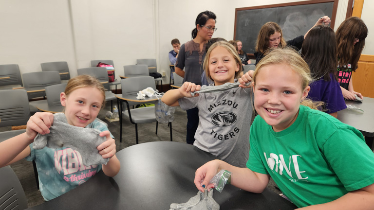 Three girls at Girl Scout Day 2024