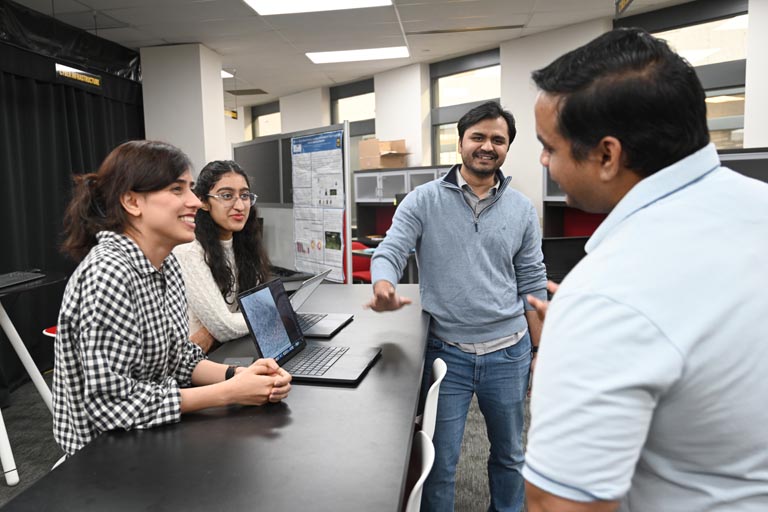 Students discussing research