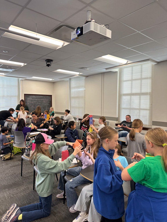 Participants doing projects at Girl Scout Day 2024