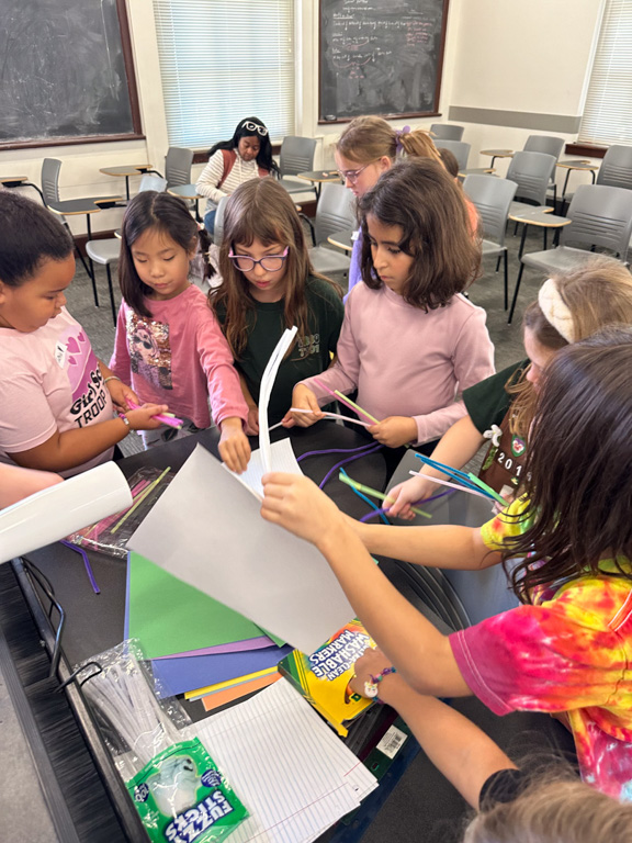 girls getting supplies at Girl Scout Day 2024