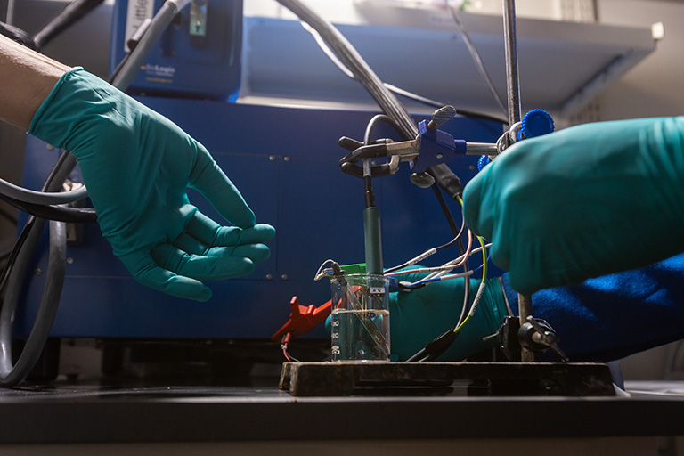 Hands shown working in a lab