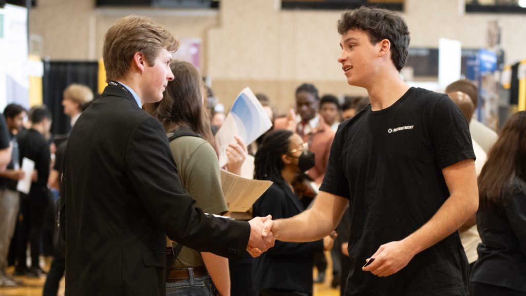 A Mizzou Engineering student shakes hands with a company representative at the spring 2026 career fair.