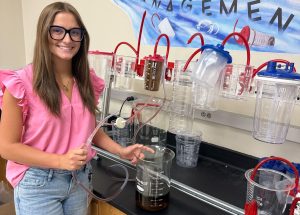 Ashlyn Ohlms testing medical tubing in a Cardinal Health laboratory