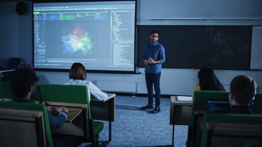 Instructor in front of room of students