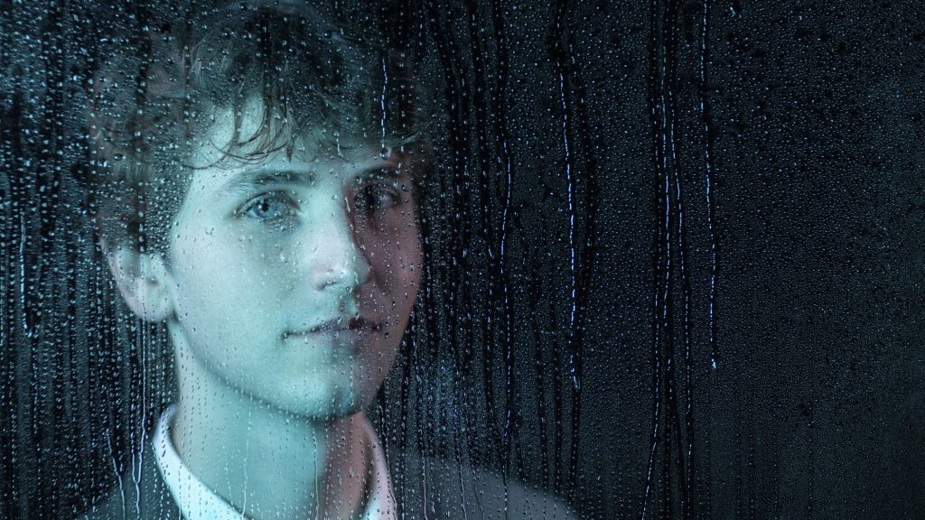 Portrait of Josh Donaldson behind a plate of glass covered with condensation