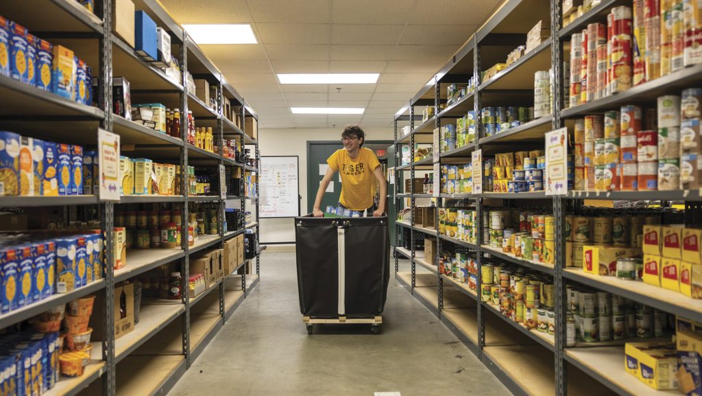 Donaldson stocks shelves at Tiger Pantry.