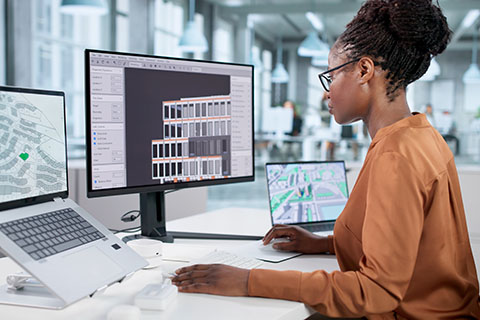 Woman sits at a computer