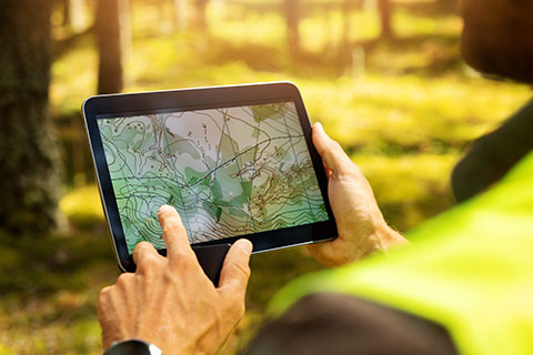 View of hands holding a using a tablet
