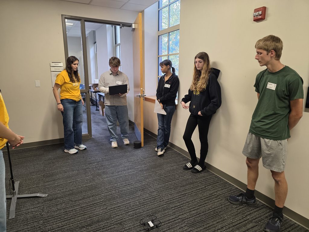 Campers observe a small quadcopter