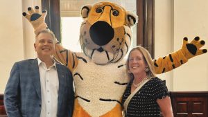 Chuck Beitel and Kara Chmielewski pose with Truman the Tiger